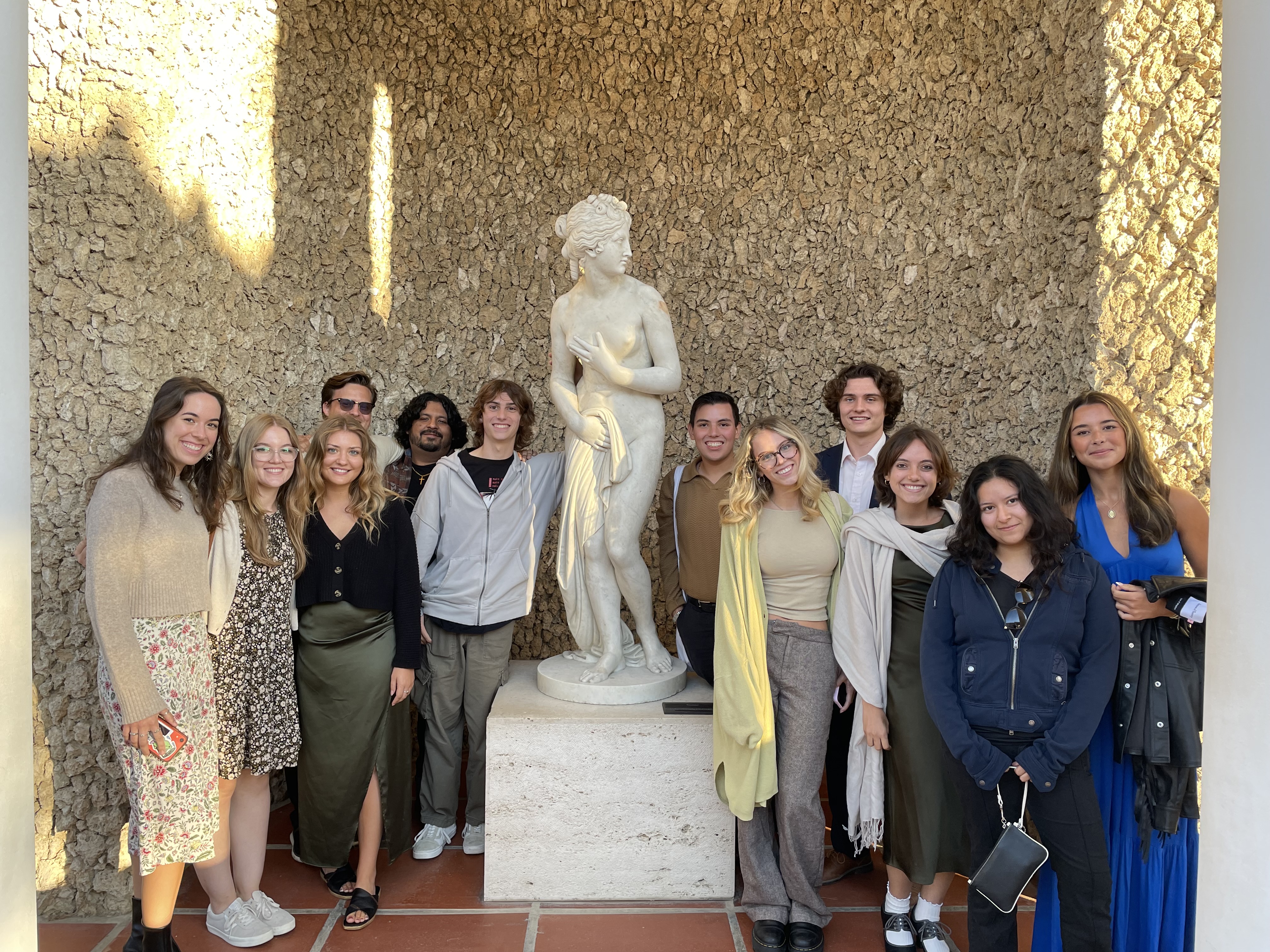 Students gather around a statue at the Getty Villa